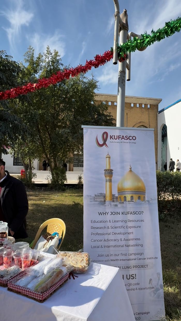 KUFASCO banner beside the booth table